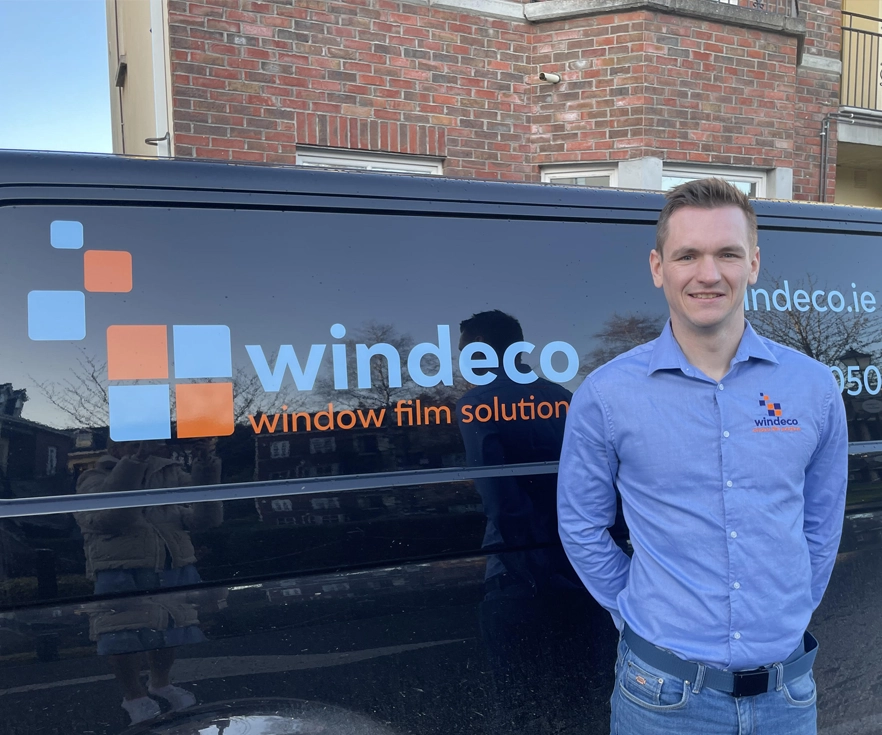 windeco worker standing in front of the van